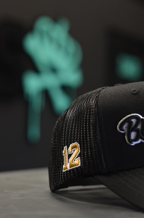 BLACK TRUCKER CAP - BLACK AND GOLD DETAIL